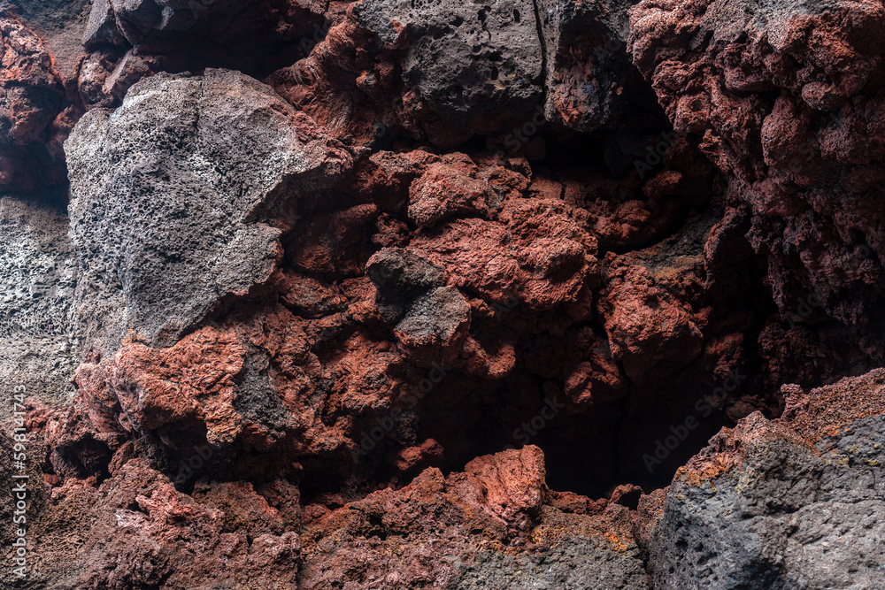 Detail of the red colors in the volcanic stones in Charco Manso on the island of El Hierro. Canary Islands Detail of the red colors in the volcanic stones in Charco Manso on the island of El Hierro. Canary Islands