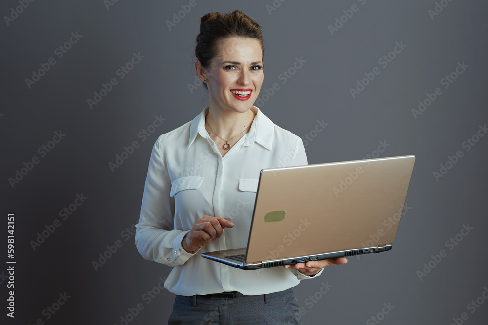 happy stylish woman worker isolated on grey happy stylish woman worker isolated on grey