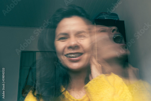 Laughing happy on the outside, crying sad on the inside. Broken soul. Soul leaving the body screaming. Desperate emotion. Sadness. Depression. Fake happiness. How I look vs how I really feel