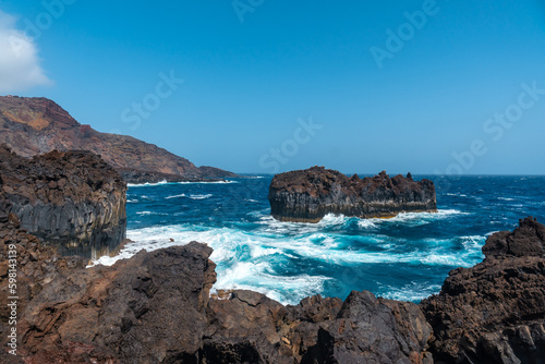 Roque de Las Gaviotas seen from the volcanic trail in the village of Tamaduste on the island of El Hierro, Canary Islands, Spain
