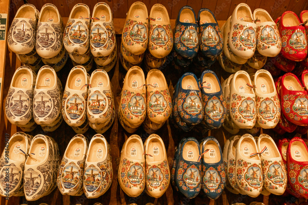 Rows and colourful wooden clogs, traditional dutch footwear in Amsterdam, dutch shoes