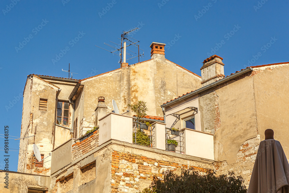 View at mediterrean houses in croatia in early spring against blue sky