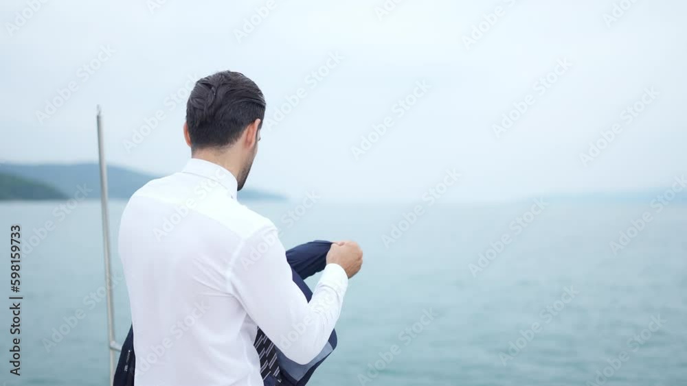 Portrait of Confidence Caucasian businessman relaxing with outdoor lifestyle for successful business travel nature ocean with sailing on luxury private catamaran boat yacht on summer holiday vacation. Portrait of Confidence Caucasian businessman relaxing with outdoor lifestyle for successful business travel nature ocean with sailing on luxury private catamaran boat yacht on summer holiday vacation.