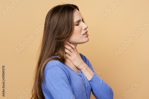 Sick caucasian woman has a sore throat, strong pain, need medical treatment isolated on background. Health care concept 
