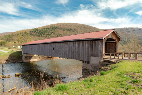 Historic Hamden timber covered bridge in the Hamlet of Hamden, Delaware County NY photo