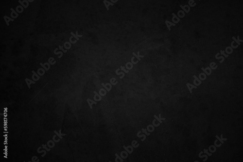Art black concrete stone texture for background in black. Cement and sand grey dark detail covering.