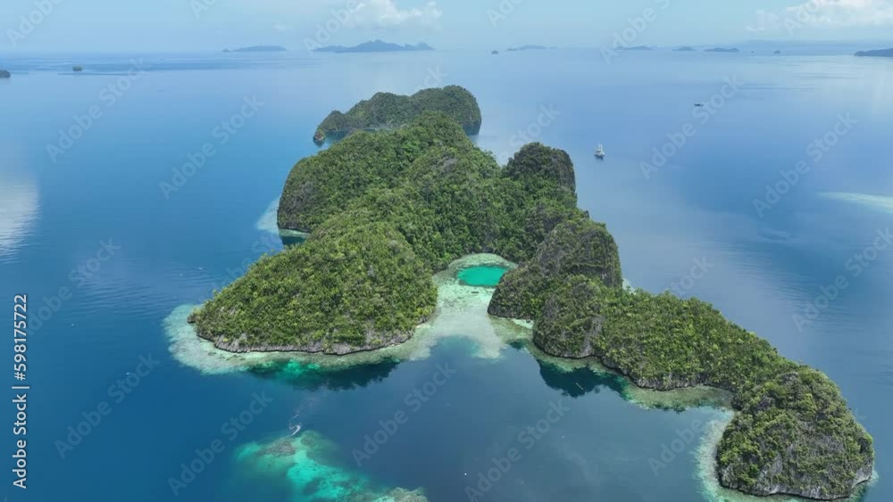 Coral reefs surround the dramatic limestone islands that have been ...