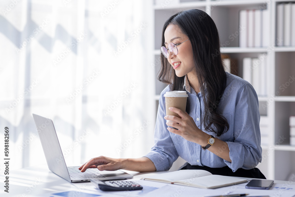 Asian Business woman using calculator and laptop for doing math finance on an office desk, tax, report, accounting, statistics, and analytical research concept
Asian Business woman using calculator and laptop for doing math finance on an office desk, tax, report, accounting, statistics, and analytical research concept