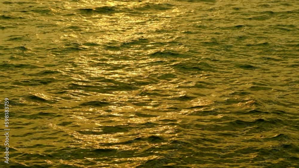 sea water and waves at sunset The magic of tropical waters and paradise beaches in the Andaman Sea.