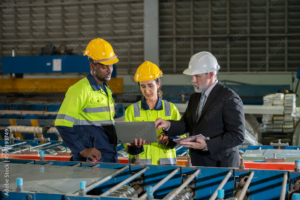 woman engineer assistant secretary in helmet inspection check control heavy machine construction installation in industrial factory with boss manager. Boss and partnership check maintenance factory