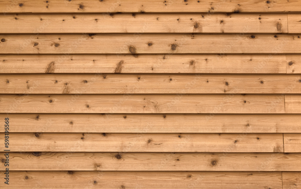 Naklejka premium 天然の木材を使った木目の板壁