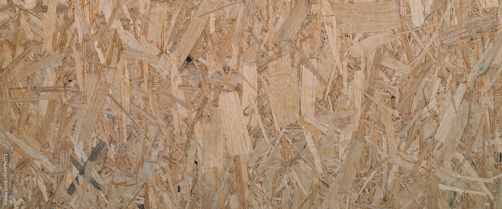 Minimal backdrop with pattern of natural pressed sawdust close-up. Minimalist background with sheet of plywood with compressed sawdust fragment. Wooden texture template close up. Minimal backdrop with pattern of natural pressed sawdust close-up. Minimalist background with sheet of plywood with compressed sawdust fragment. Wooden texture template close up.