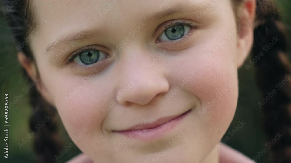 Close up portrait of attractive smiling pretty little girl kid, happy looking at camera, enjoying spring or summer nature. Romantic inspiration wanderlust. Adventure and travel concept Close up portrait of attractive smiling pretty little girl kid, happy looking at camera, enjoying spring or summer nature. Romantic inspiration wanderlust. Adventure and travel concept