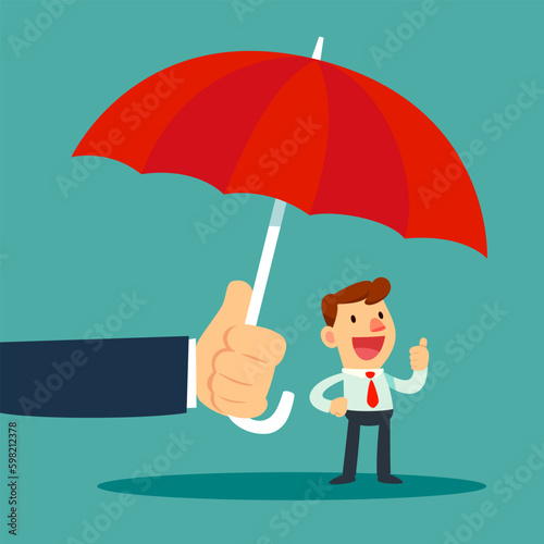 big hand holding umbrella protecting small businessman
