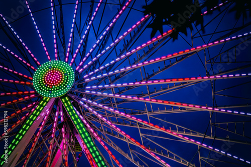 Colouful Ferris Wheel Close-up with Pink, Green at Night (ID: 598212794)