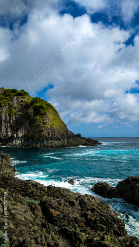 beach and rocks and cliff in Lombok Island, Indonesia