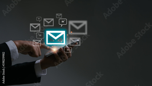 Email concept.Businessman using smart phone for email with notification alert, Online communication concept.email icons.