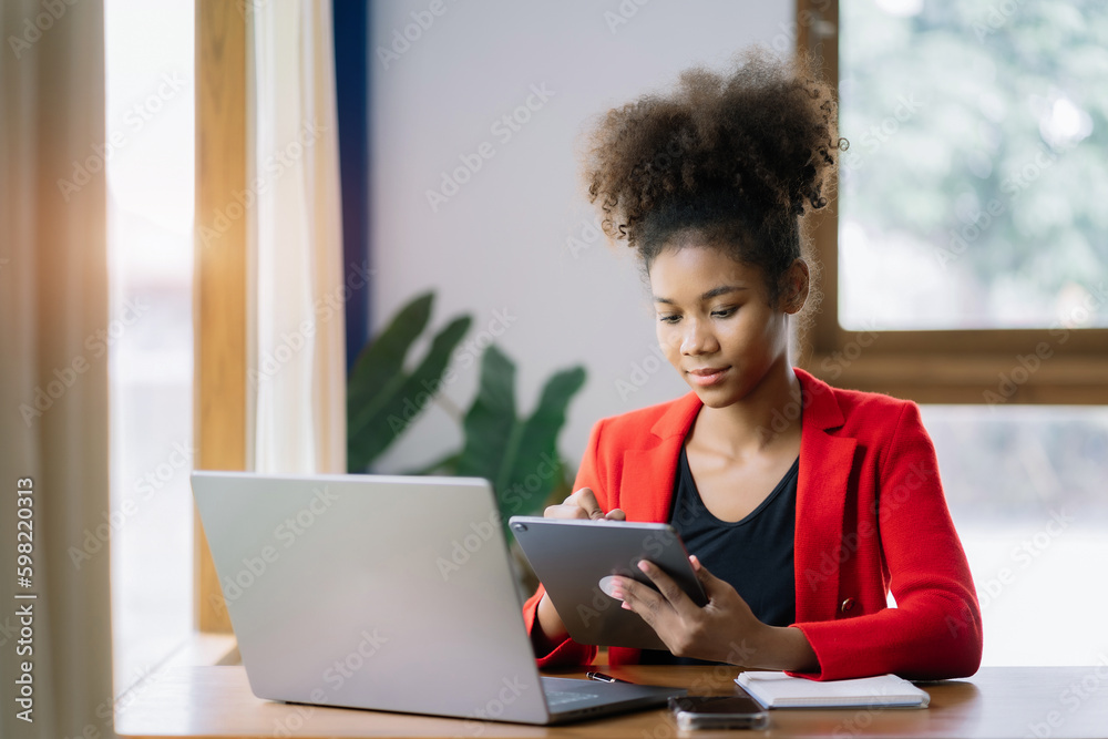Thinking about how to take the business to technological heights. attractive young businesswoman working in her home office. Thinking about how to take the business to technological heights. attractive young businesswoman working in her home office.