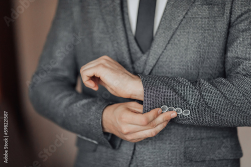 Εκτύπωση καμβά cropped photo of a stylish man adjusting his jacket