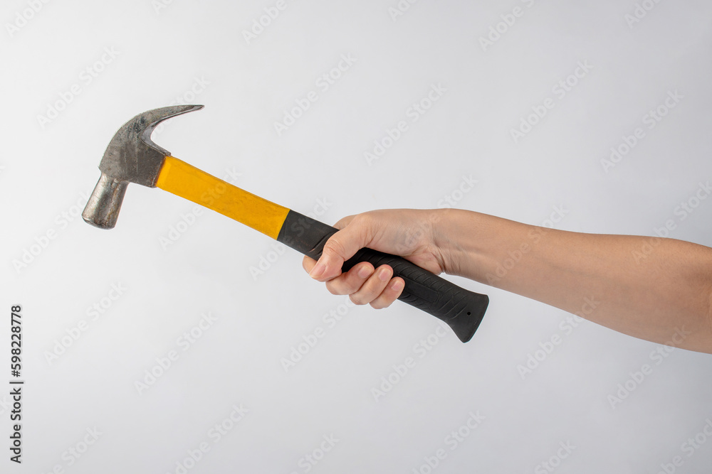 Hand with hammer on white background. Hand with hammer on white background.