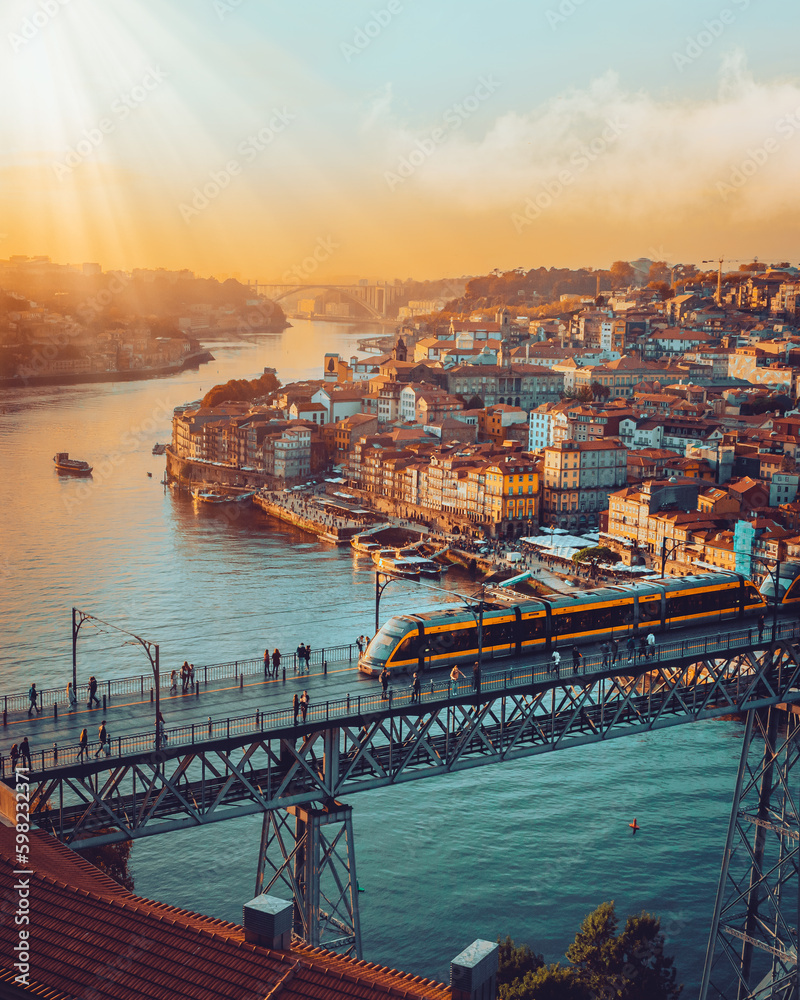 Porto, Portugal Dom Luis Iron Bridge at sunset featuring Douro River, Metro Train and Port Wine Boats  - obrazy, fototapety, plakaty 