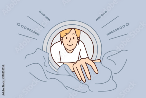 Woman looks into washing machine to get clean clothes while doing housework and taking care hygiene Generative AI
