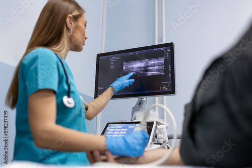 Φωτογραφία Doctor check ultrasound of patient arm in a clinic for medical and healthcare research at a hospital