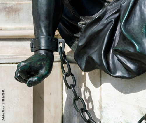 Detailfoto der angeketteten Krieger am Sockel der Reiterstatue Friedrich Wilhelm von Brandenburg, Schloss Charlottenburg, Berlin, Deutschland photo