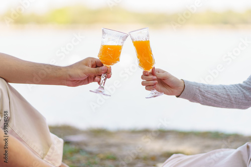 In love couple enjoying picnic time in park outdoors Picnic. happy couple relaxing together with picnic Basket