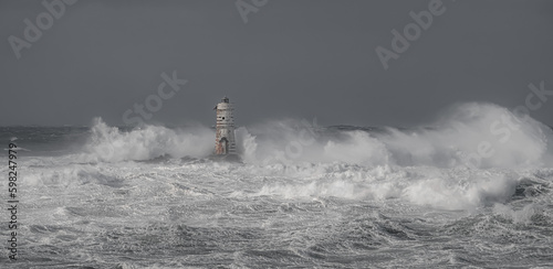 Lighthouse and storm - The Mangiabarche rock of Calasetta during the February 2023 storm
