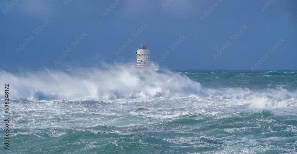 Lighthouse and storm - The Mangiabarche rock of Calasetta during the February 2023 storm
