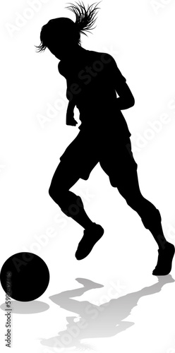 A female soccer football player woman in silhouettes