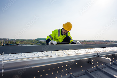 Professional engineer work to maintenance of photovoltaic panel system.  © Kawee
