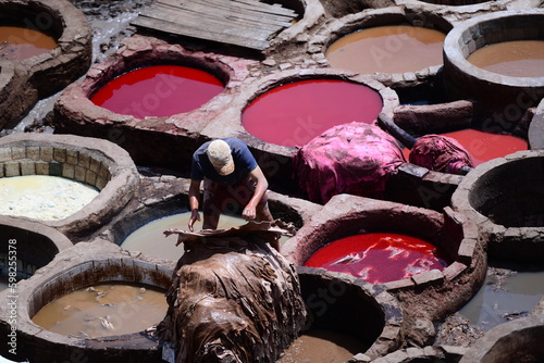 Men working leather in fez tannery in morocco