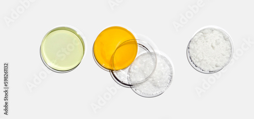 Poly Aluminium chloride liquid, Shower cream, Microcrystalline and Cetyl esters wax in Petri dish on white laboratory table. Chemical ingredient for Cosmetic and Toiletries product. Top View