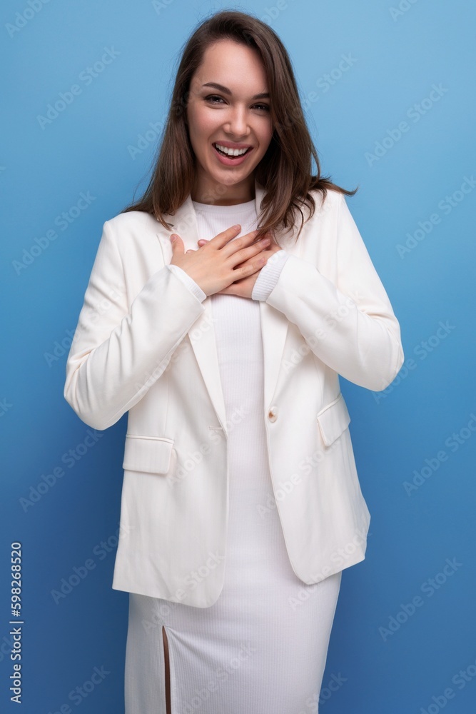 smiling well-groomed long-haired brunette business woman in white dress smiling well-groomed long-haired brunette business woman in white dress