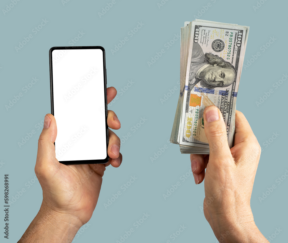 Hand holding mobile phone screen mockup and paper money, dollars - obrazy, fototapety, plakaty 