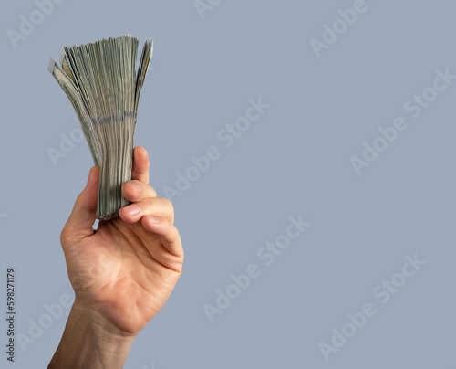 Hand holding banknotes, money. Banner background with copy space for text