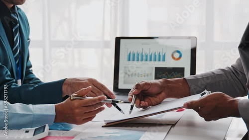 Young colleagues discuss business brainstorming and price charts analyze business people at the desk brilliantly in modern collaborative office teamwork ideas. Calculate personal tax for customers