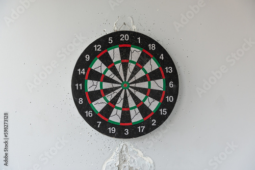 darts on the wall in a hole from darts