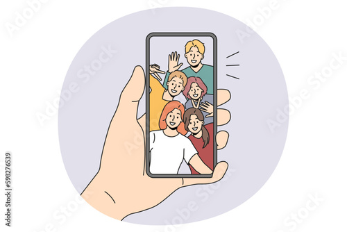 Person hold smartphone talk on video call with diverse friends. Man use cellphone have online webcam chat or communication on gadget with international mates. Vector illustration. Generative AI
