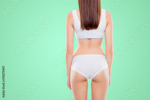 Cropped rear view of sporty ideal girl with fit booty bum and slim waist in cotton underwear isolated over white background. Enhancement concept Generative AI