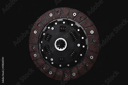 car clutch disc close-up on a black background, selective focus