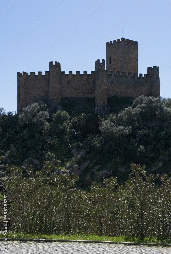 Almourol, Portugal - March 27, 2023: The Castle of Almourol is a medieval castle atop the islet of Almourol in the middle of the Tagus River. Praia do Ribatejo. Sunny spring day Selective focus
