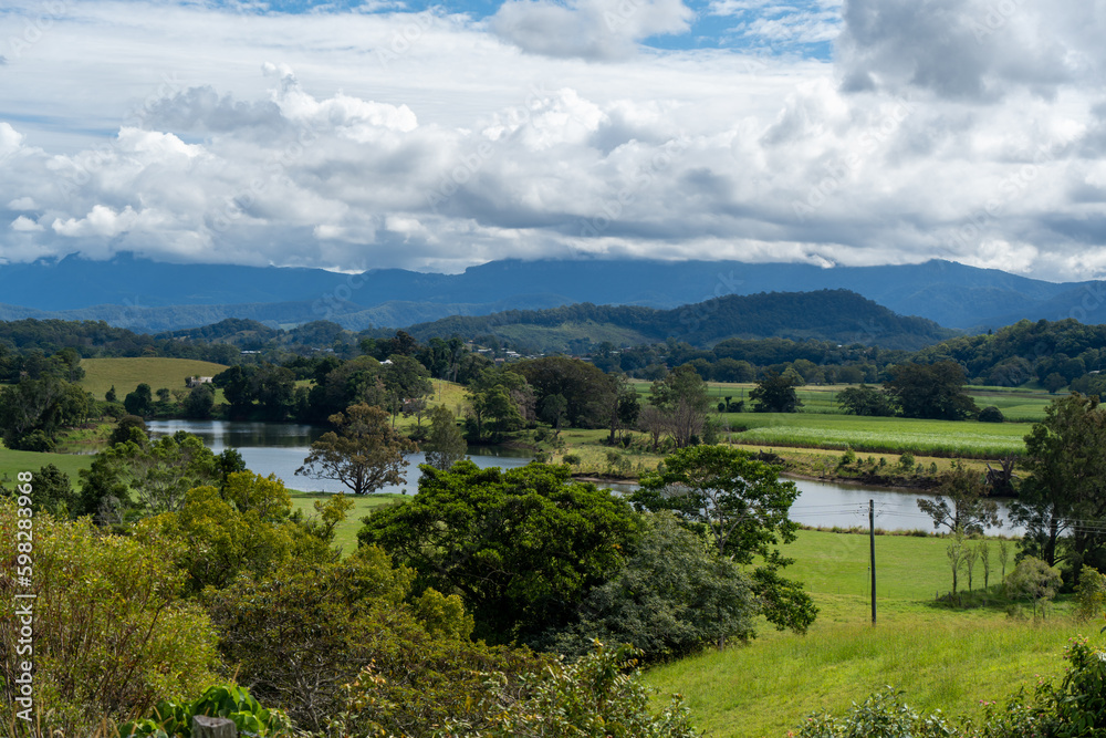 View of the Tweed Valley, from Tweed Regional Valley, with mountains of Lamington National Park and Springbrook Plateau on the horizon. Murwillumbah, New South Wales, Australia