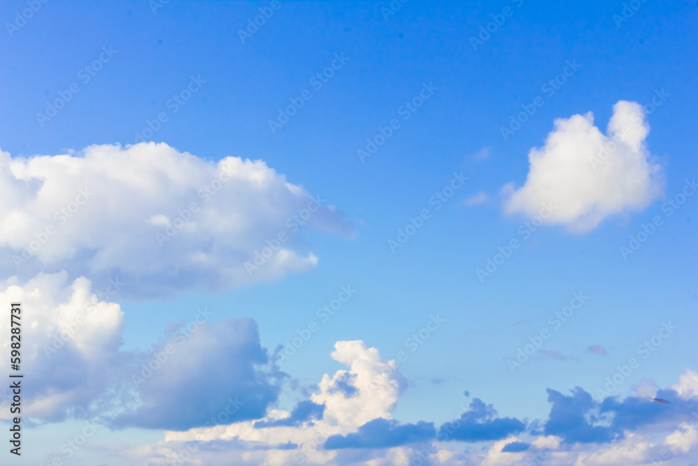 Blue sky background with clouds. Clouds on a clear day