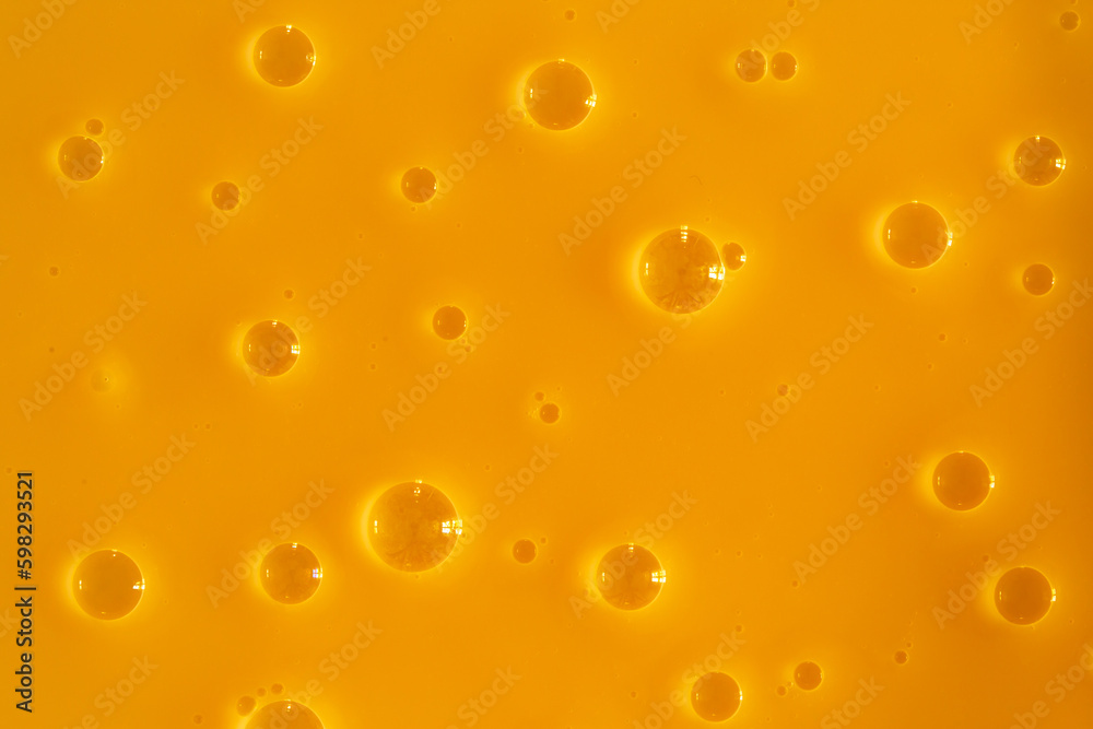 Bubble yellow texture background. Berry gel to cleanse the skin of the face and body. Spa treatments, skin care. Bath foam, detergent. Gold slime