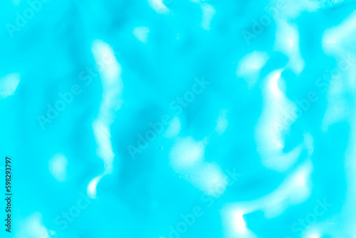 Background of light blue cream texture. Berry fruit yogurt or whipped cream. Smooth surface of body lacquer cream. Slime turquoise.