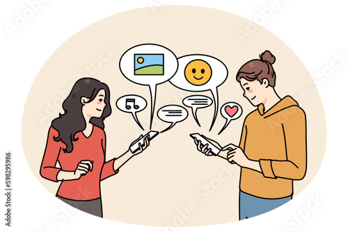 Smiling girlfriends using cellphones communicating online on social media. Happy girls chat text on internet on smartphones, send share messages on devices. Communication. Vector Generative AI