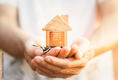 Home loan, home insurance, family life assurance protection, financial mortgage for house building, and legacy planning investment concept with children - parent's hands holding private property